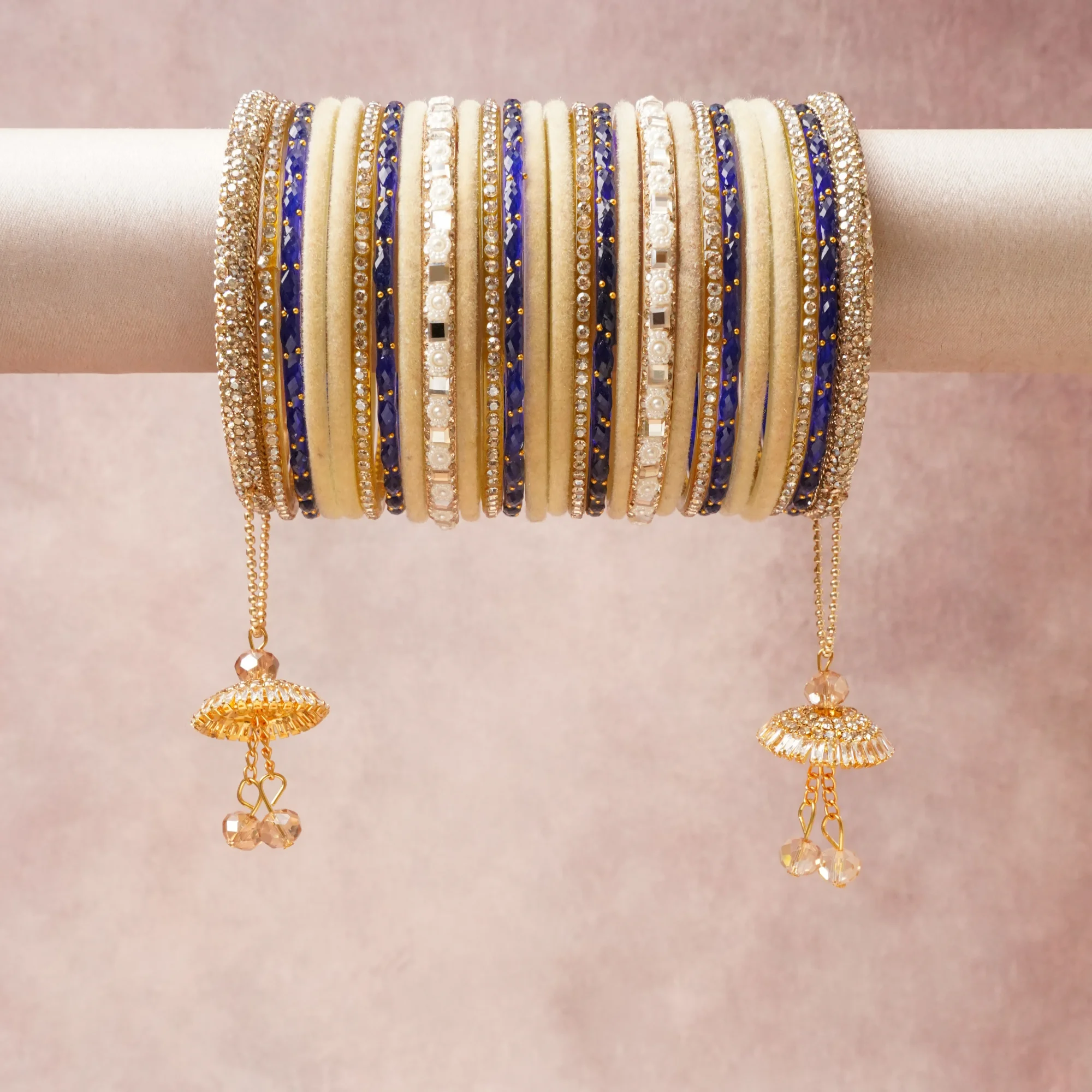 A grounding Cream forms the heart of the set, while touches of Gold, Clear Crystal add charm.

A thoughtful composition of Velvet, Gold-toned Metal, Cubic Zirconia, Simulated Pearl, Enamel, Faceted Glass, designed to feel complete without being heavy.
Each element layers seamlessly, creating a look that is refined, wearable and quietly striking.